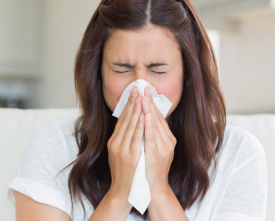 woman sneezing
